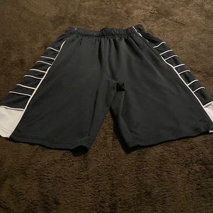 Men’s pony shorts, black with white piping, size small